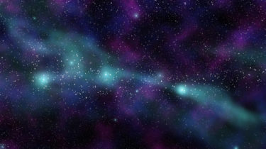 A nebula of greens and purples in space